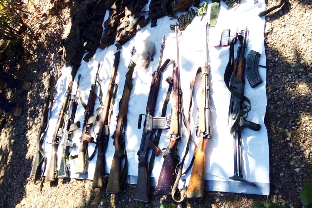 <p>Police personnel displayed seized arms and ammunition recovered after an encounter with a splinter group of extremists JJMP (Jharkhand Jan Mukti Parishad) at a forest under Latehar…