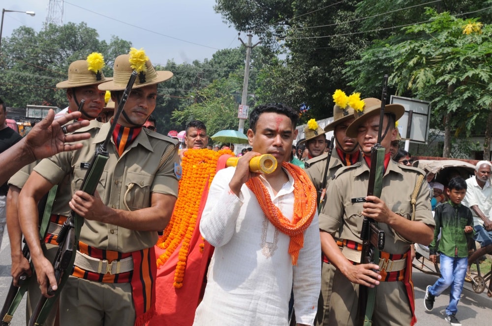 <p>Jharkhand Armed Police forces along with Nepali devotees participate in a Doli Yatra during the seventh day of Navratra festival in Ranchi on Wednesday.</p>
