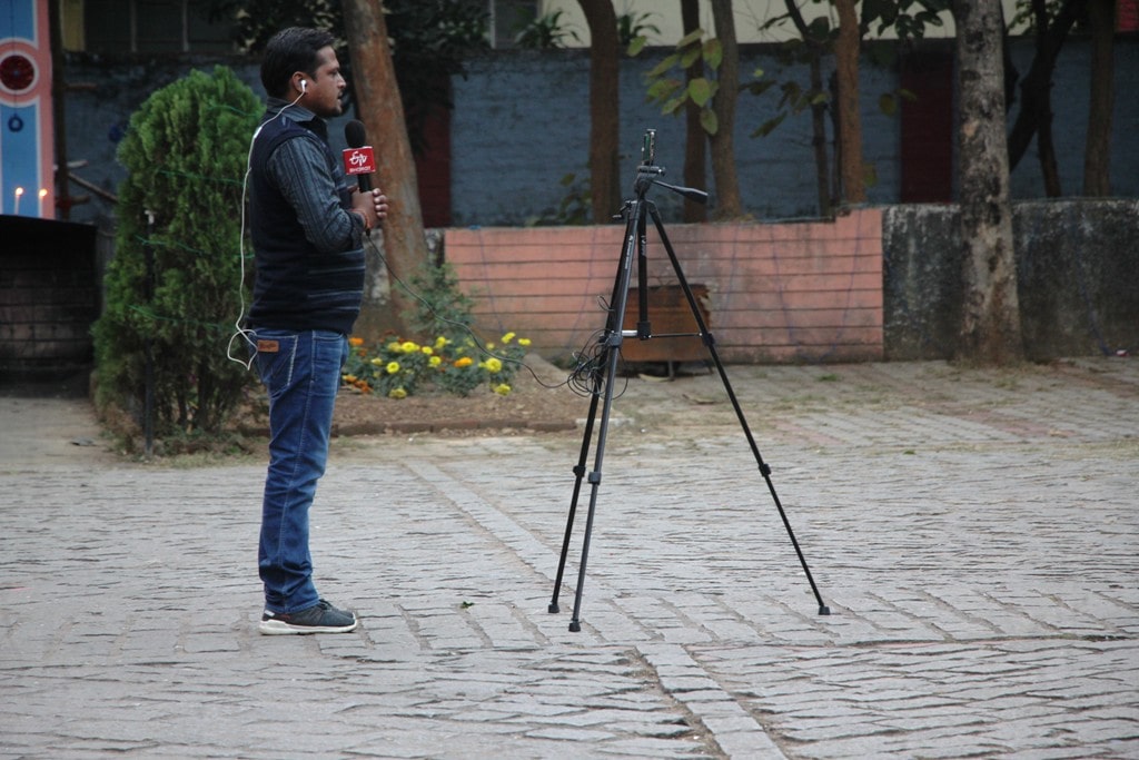 <p>A reporter of a local TV channel offers prayer to Lord Jesus on the eve of X'Mass at a church in Ranchi on Monday.</p>
