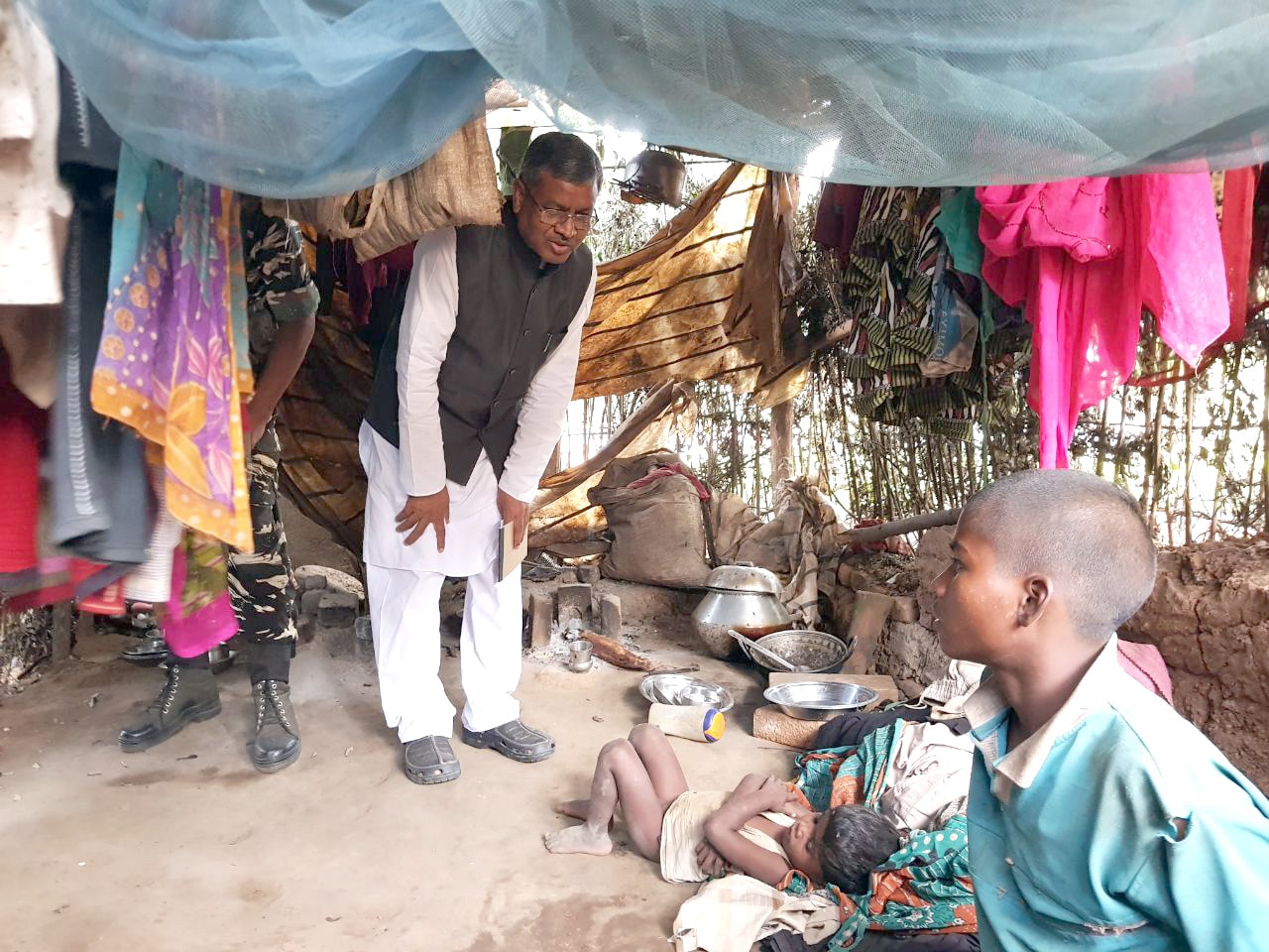 <p>Former Chief Minister and JVM Chief Babulal Marandi along with others interacts with family members of death of 11 years old girl child in Jaldega under Simdega district during…