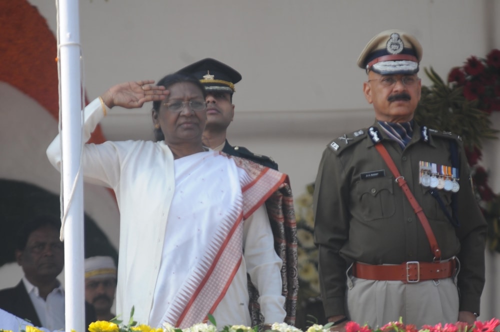 <p>Governor Droupadi Murmu taking salute after hoisting the National flag during the 69th Republic Day celebrations at Morhabadi ground in Ranchi on Friday. DGP DK Panday is also…