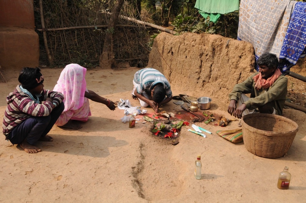 <p>Sawna Hembrom performs puja for well being of the patients at his home at Langopade village near Dumka of Jharkhand in India.</p>
