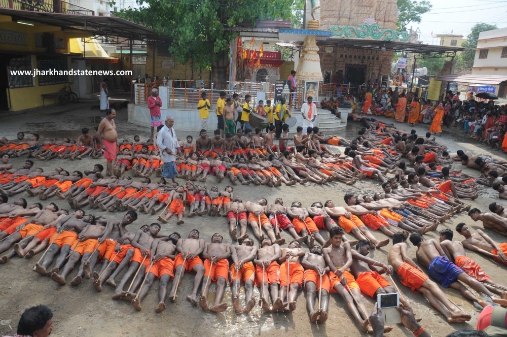 <p>Farmers who were without cloth on their bodies lie on the hot ground with sticks as they pray for rain during the Manda festival at a temple on the outskirts of Ranchi,capital of…