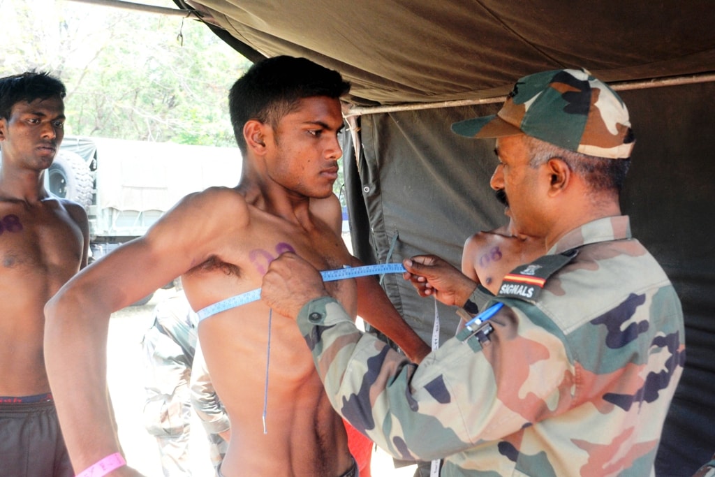 <p>An Army official takes various tests of candidates appearing for Army recruitment at Army ground, Morhabadi in Ranchi on Monday. </p>
