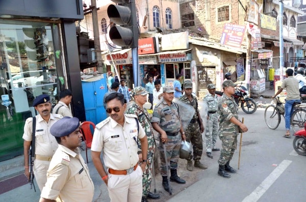 <p>Police personnel vigil second day of clash between two communities at Main road in Ranchi on Wednesday. </p>
