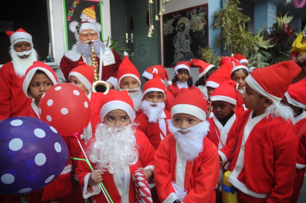 <p>Sherwood (N) Public School children dressed up as Santa Claus attending their class celebrating Christmas festival in Ranchi on Friday.</p>

