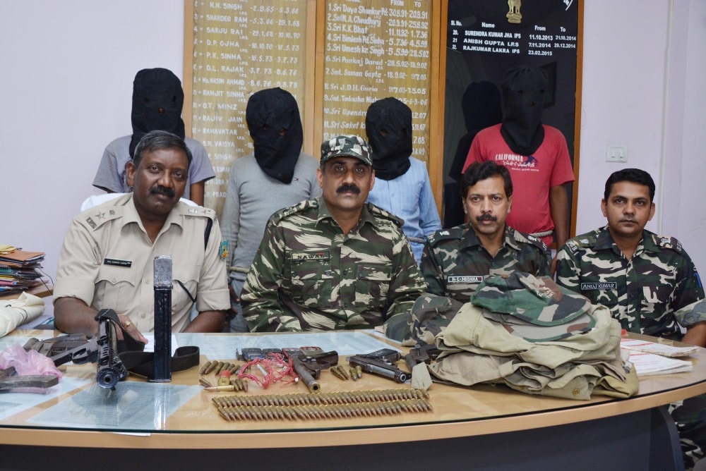 <p>Rural Superintendent of Police  Raj Kumar Lakra (L), ASP operations RC Mishra (2nd_R), Deputy Commandant operation Anuj Kumar (R) and other senior officials showing four arrested…