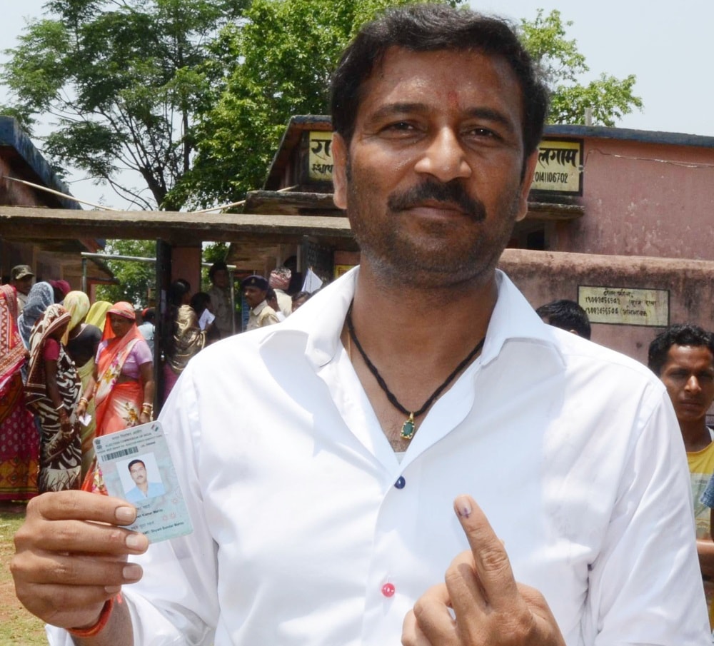 <p>Former Jharkhand Deputy Chief Minister and AJSU Party Chief Sudesh Mahato, show his ink-marked finger after casting his vote at a polling station in Silli 63 KMs from Ranchi on…