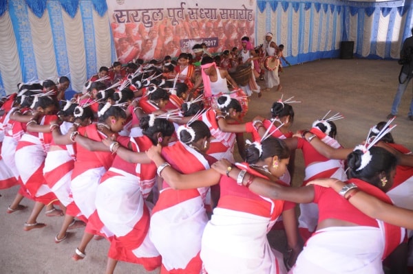 <p>Adivasi students performs cultural programme on the eve of the Sarhul festival, the festival of flowers among the tribals of eastern India in Ranchi on Wednesday.</p>
