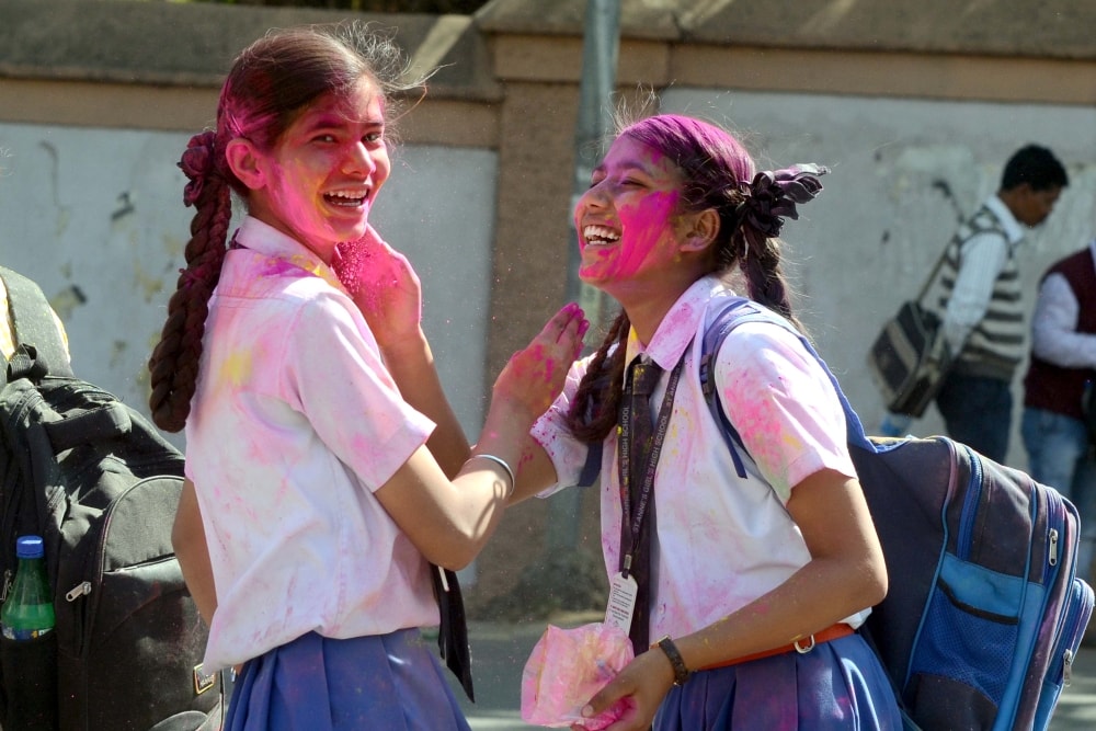 <p>College students play with 'Gulal' ahead of Holi festival  in Ranchi on Wednesday. </p>
