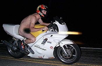 Man rides mo-bike naked,falls in police net