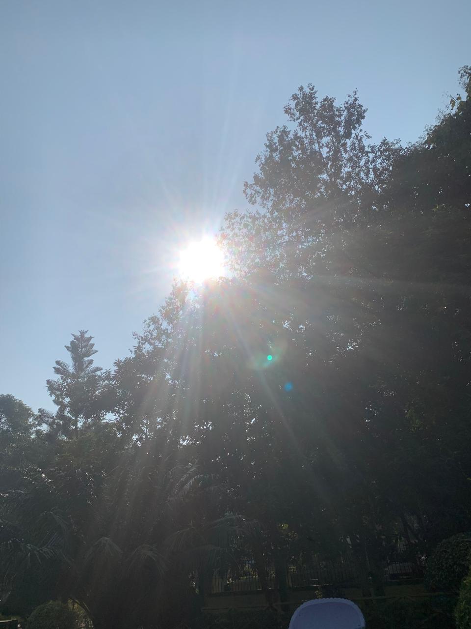 Delhi Chokes Sky ,Jharkhand city breaths, showing  bright Sun & Moon in blue sky 