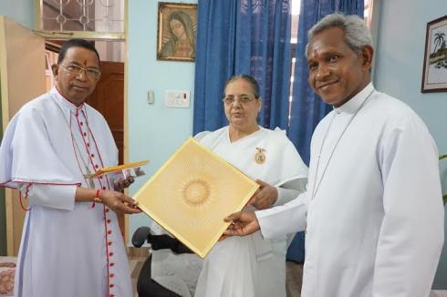 Brahmakumari Nirmala Bahan ties Rakhi on Cardinal Telesphore P.Toppoâ€™s wrist