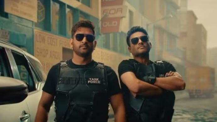 from-helicopter-shot-to-wielding-guns-dhoni-moves-forwardrocks-in-an-action-packed-teaser
